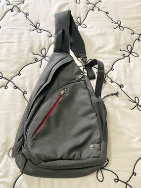 Men's Black Sling Belt Bag with Red Zip Accent